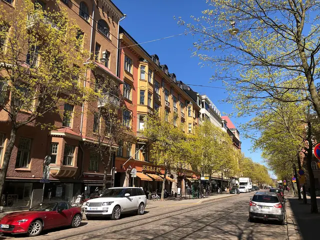 Bulevardi street in spring: tree-lined boulevard with 19th-century facades and tram tracks
