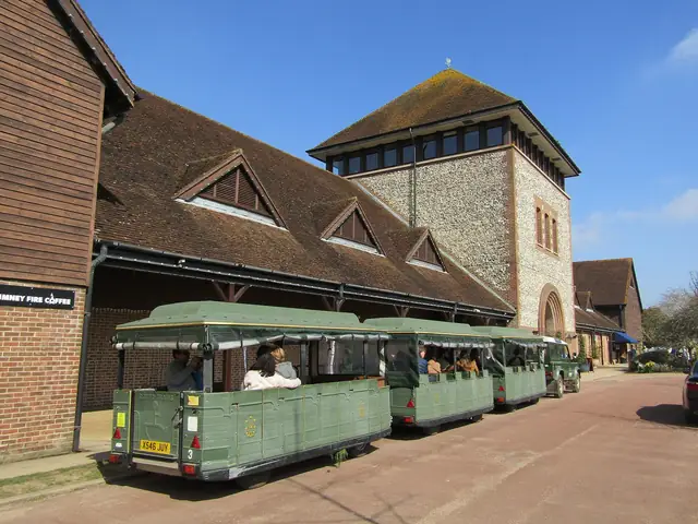 Denbies Wine Estate's flint-and-brick winery and tower, the vineyard land train waiting outside
