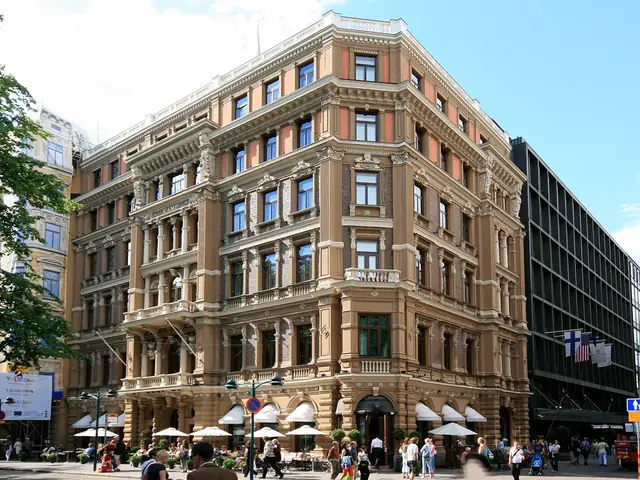 Hotel Kämp's ornate corner facade on Pohjoisesplanadi with terrace parasols