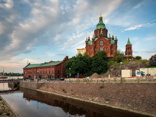 Katajanokka canal at golden hour with the red-brick warehouses and Uspenski Cathedral