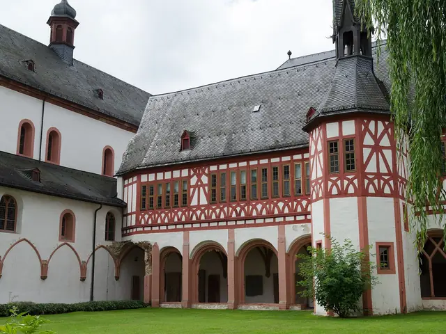 Kloster Eberbach's cloister garth: the white abbey ranges and a red half-timbered wing