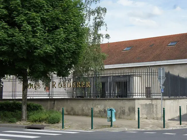 Louis Roederer's cellar buildings on the corner of rue de Savoye and rue du Champ-de-Mars, Reims, the name on the railings