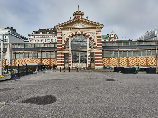 Old Market Hall's striped brick facade and arched gable on the South Harbour quay