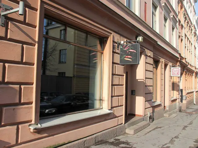 Spis's street front on Kasarmikatu: the big window and the hanging sign, 2017