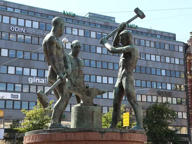 The Three Smiths statue (Felix Nylund, 1932) hammering at its anvil on Aleksanterinkatu