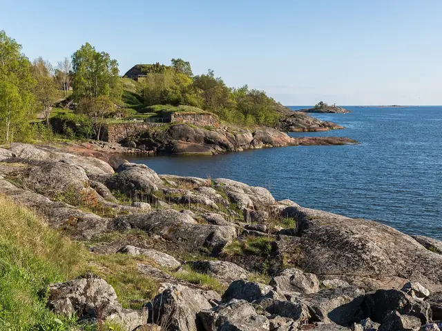 Vallisaari's rocky south shore, green fortress slopes and open sea