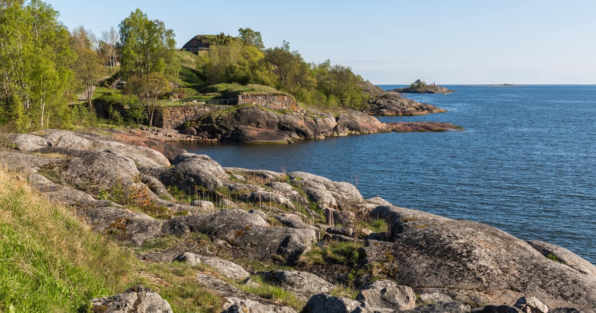 Smooth granite rocks and the open sea on the shore of Vallisaari island, Helsinki